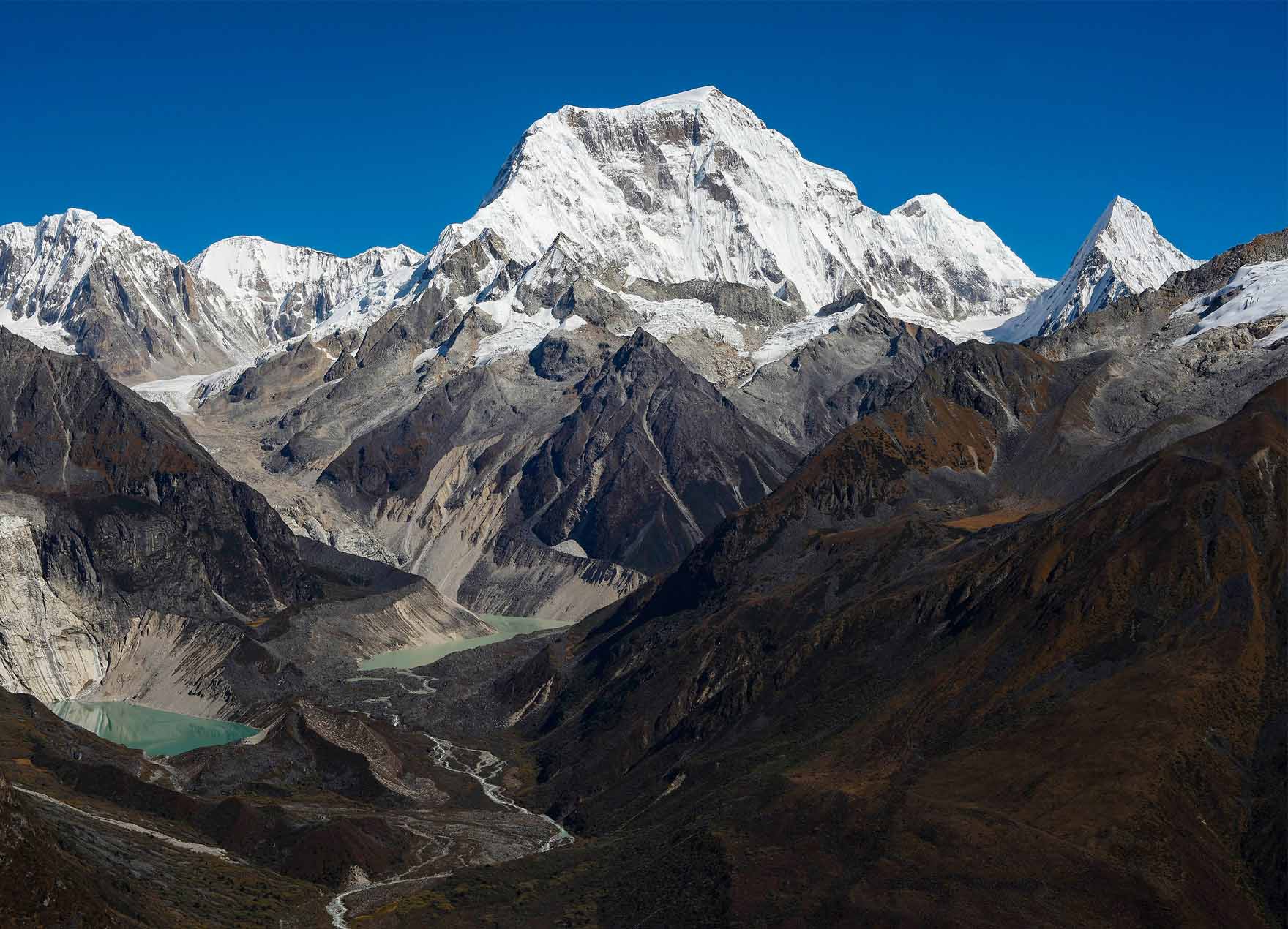 Unspoiled forested mountains and a glacial river in Bhutan